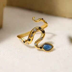Serpenti Elegant Gold Snake Ring with Blue Accents